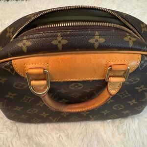 Louis Vuitton PM Trouville in Monogram canvas.